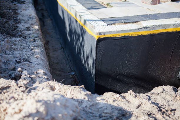 Professional Emergency Waterproofing technician working in Belmont, MI